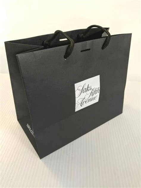 saks fifth avenue shopping bag.